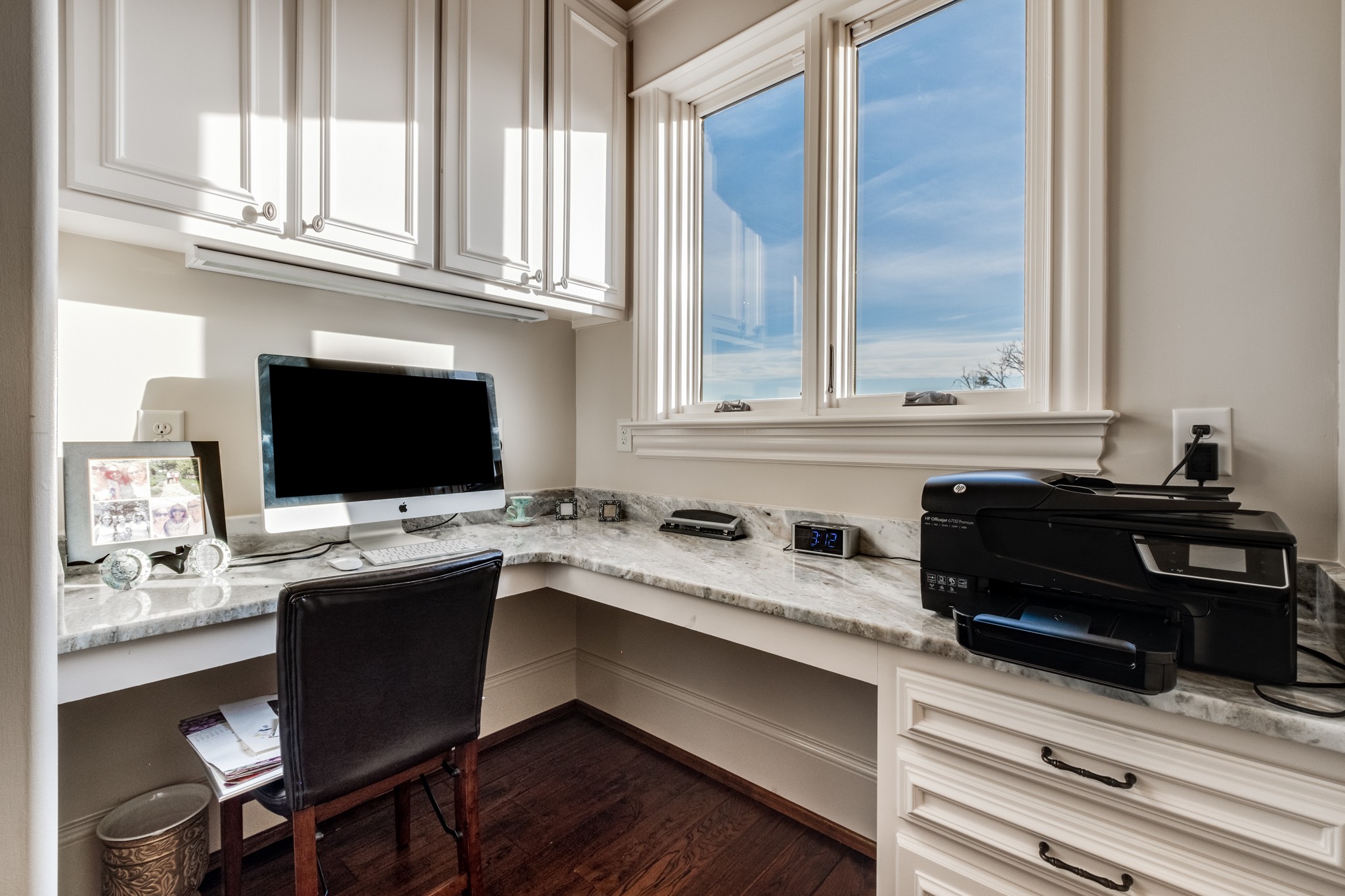 505 Legends Ridge Court Franklin, TN 37069 - Photo 33 of 70 a kitchen with a sink and a stove with wooden floor