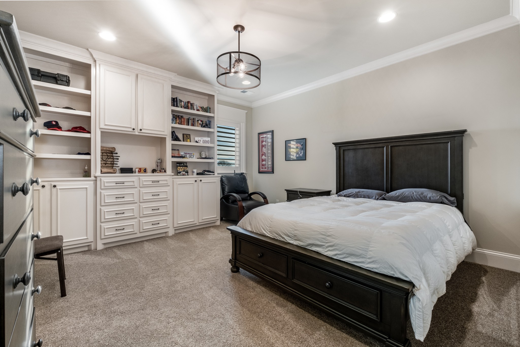 505 Legends Ridge Court Franklin, TN 37069 - Photo 45 of 70 a bedroom with a bed and a chandelier