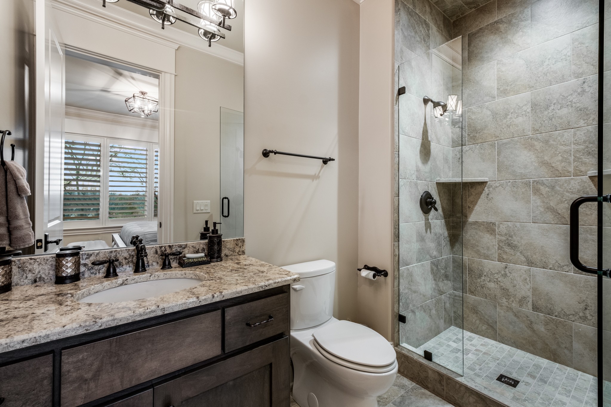 505 Legends Ridge Court Franklin, TN 37069 - Photo 55 of 70 a bathroom with a granite countertop sink a toilet a mirror and shower