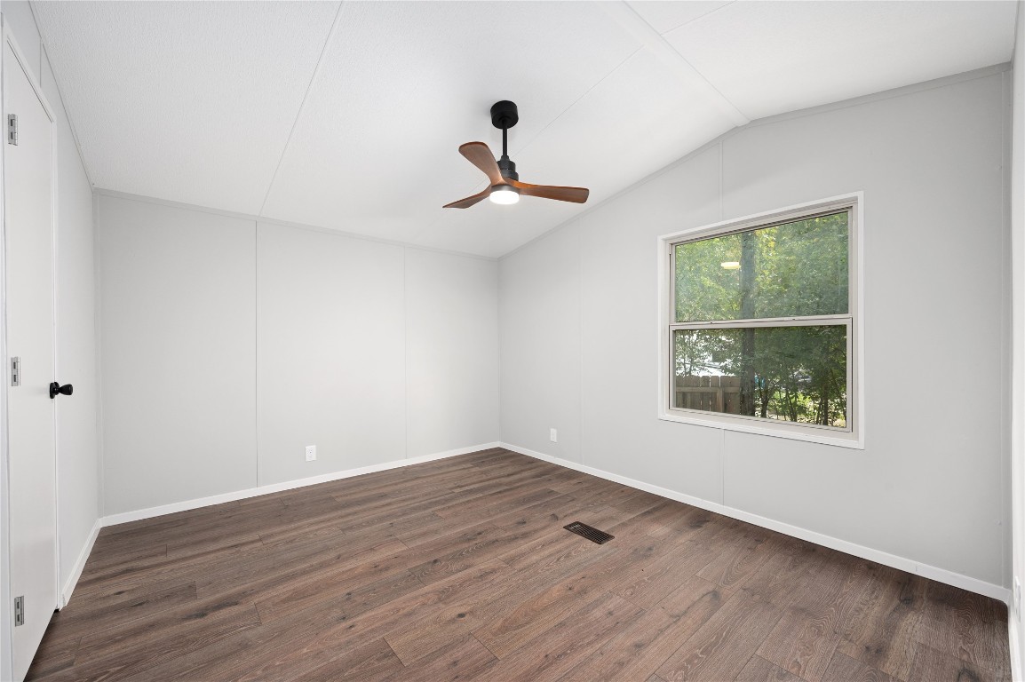 20123 McShepherd Road Georgetown, TX 78626 - Photo 12 of 27 wooden floor in an empty room with a window