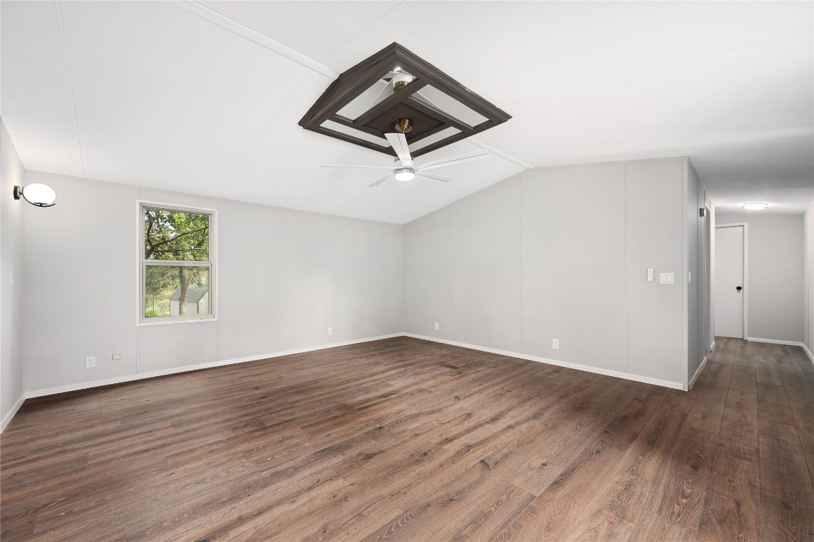 20123 McShepherd Road Georgetown, TX 78626 - Photo 7 of 27 an empty room with wooden floor and windows