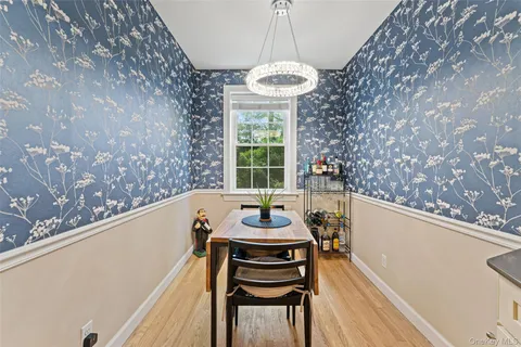 a kitchen with a table and chairs in it