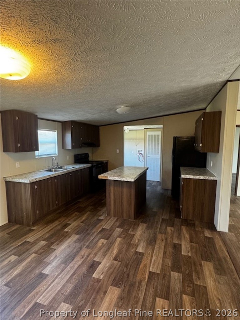 115 Burns Road Lumberton, NC 28358 - Photo 2 of 11 a large kitchen with a sink and cabinets