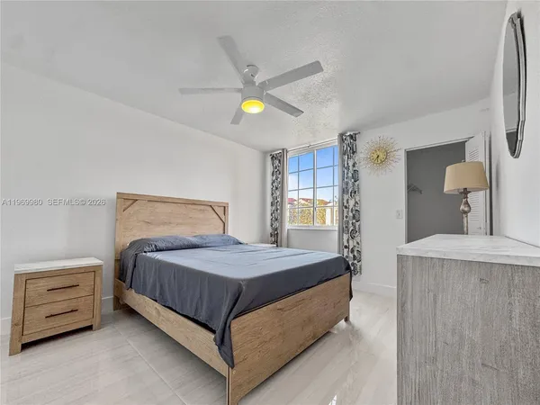 a bedroom with a bed and a dresser