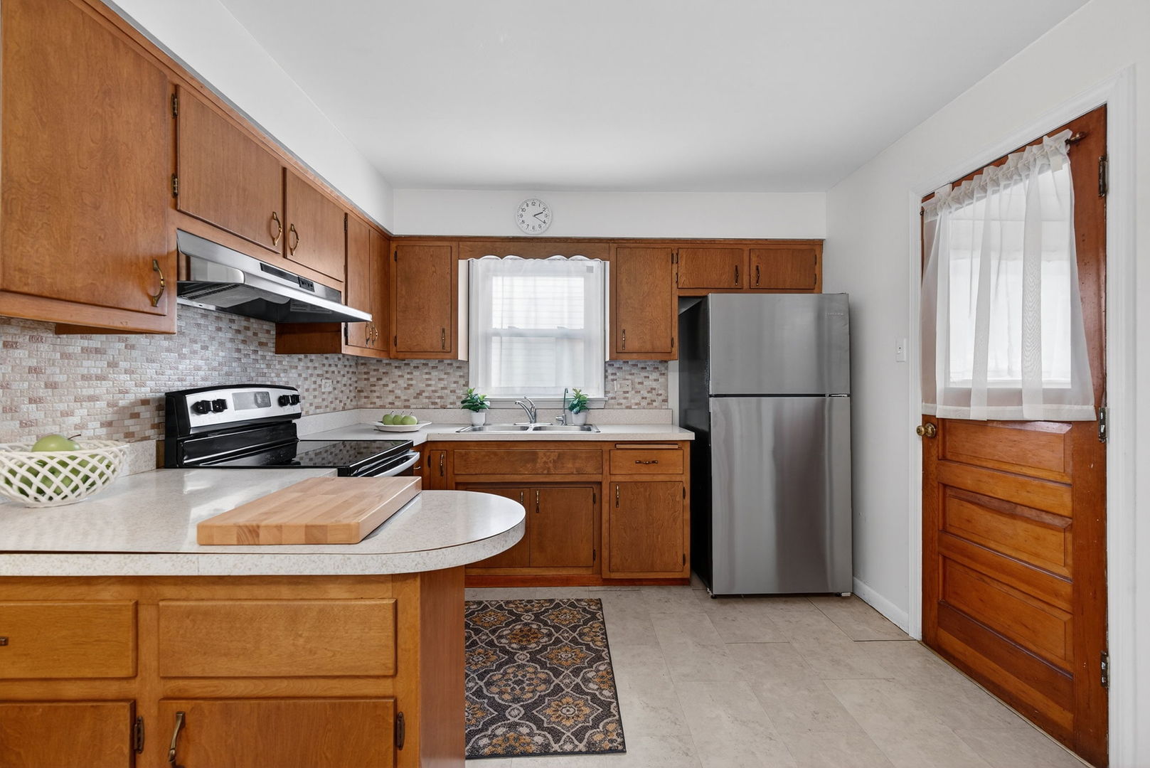 12620 Irving Avenue Blue Island, IL 60406 - Photo 12 of 37 a kitchen with stainless steel appliances granite countertop a refrigerator a stove a sink and a refrigerator