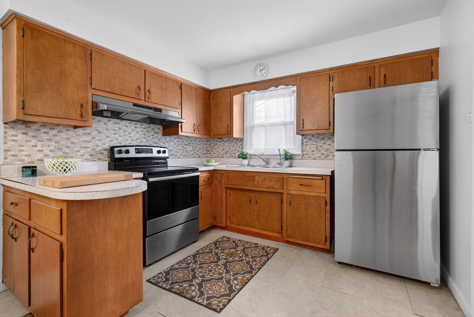 12620 Irving Avenue Blue Island, IL 60406 - Photo 13 of 37 a kitchen with a sink a stove a refrigerator and cabinets