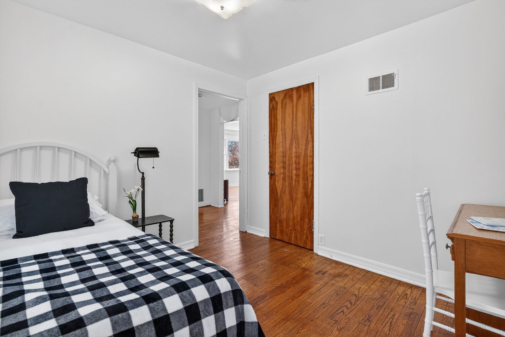 12620 Irving Avenue Blue Island, IL 60406 - Photo 22 of 37 a bedroom with a bed and wooden floor