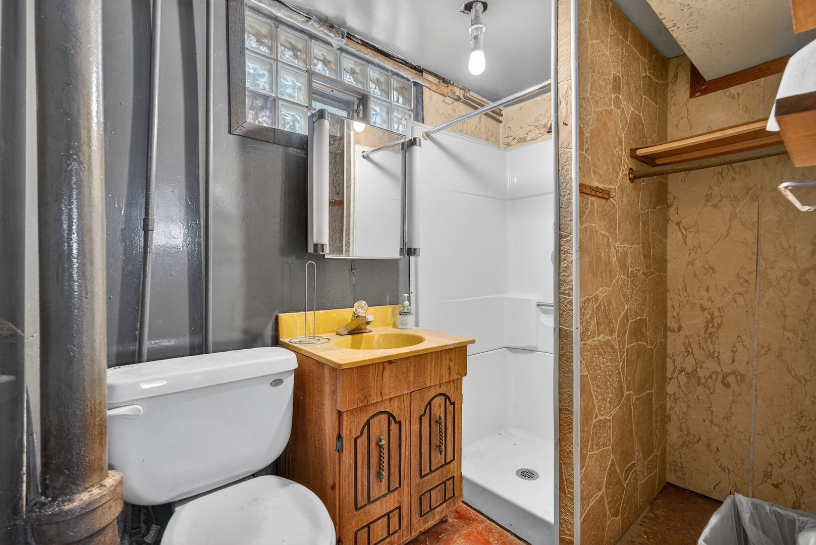 12620 Irving Avenue Blue Island, IL 60406 - Photo 32 of 37 a bathroom with a sink a toilet and shower