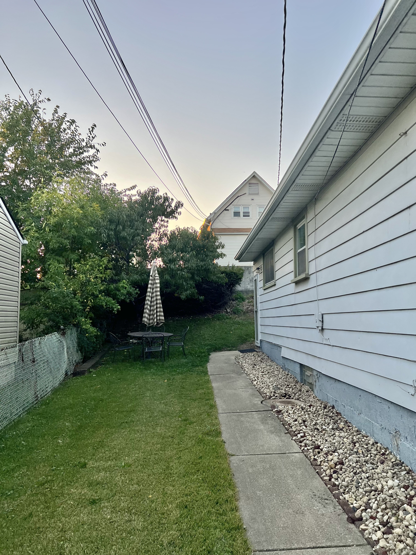 12620 Irving Avenue Blue Island, IL 60406 - Photo 35 of 37 a view of a porch with a yard