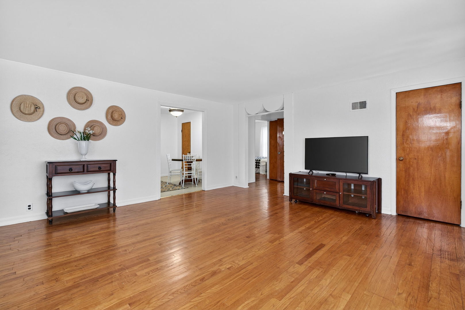 12620 Irving Avenue Blue Island, IL 60406 - Photo 7 of 37 a living room with furniture and a flat screen tv