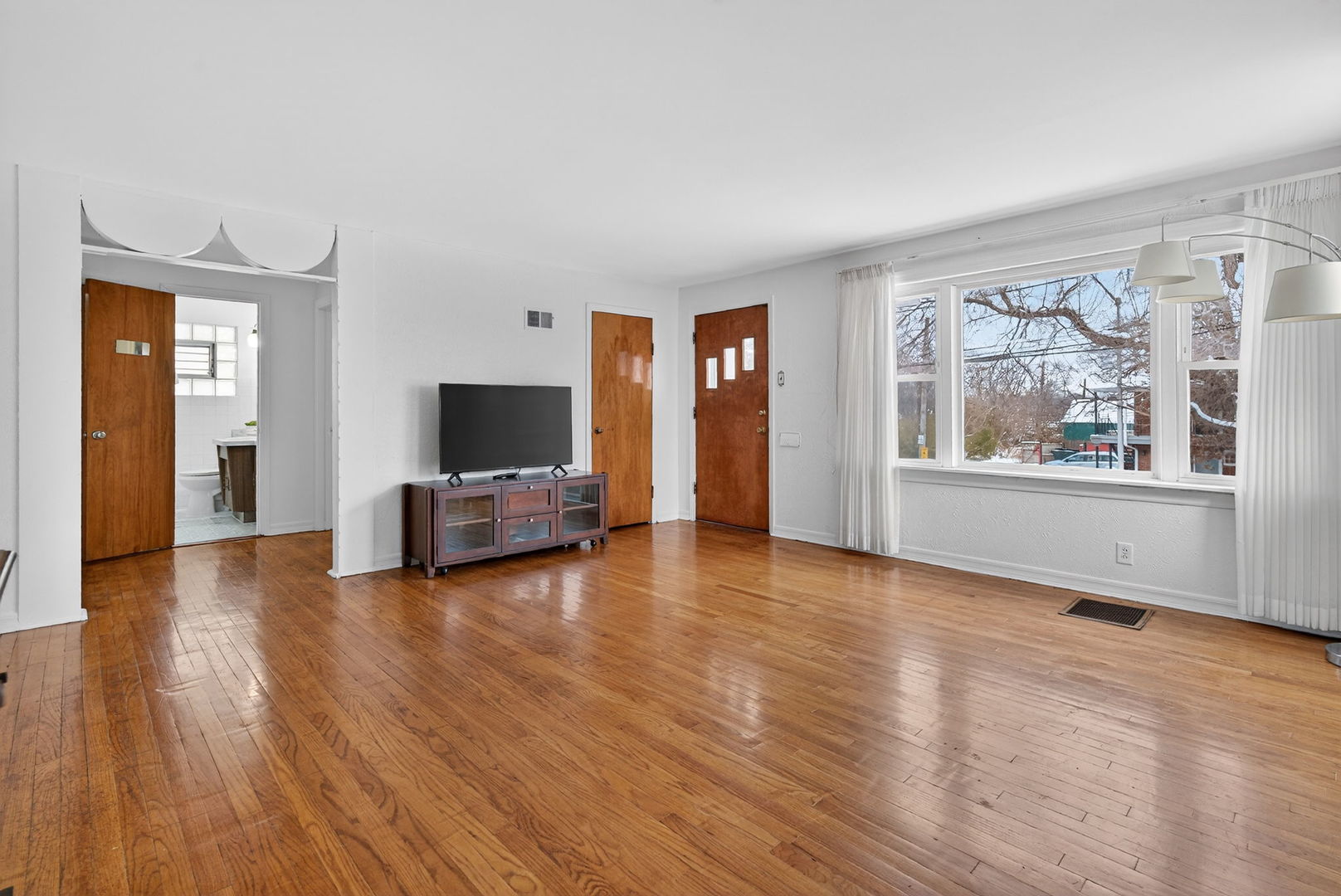 12620 Irving Avenue Blue Island, IL 60406 - Photo 9 of 37 a view of a livingroom with wooden floor and furniture