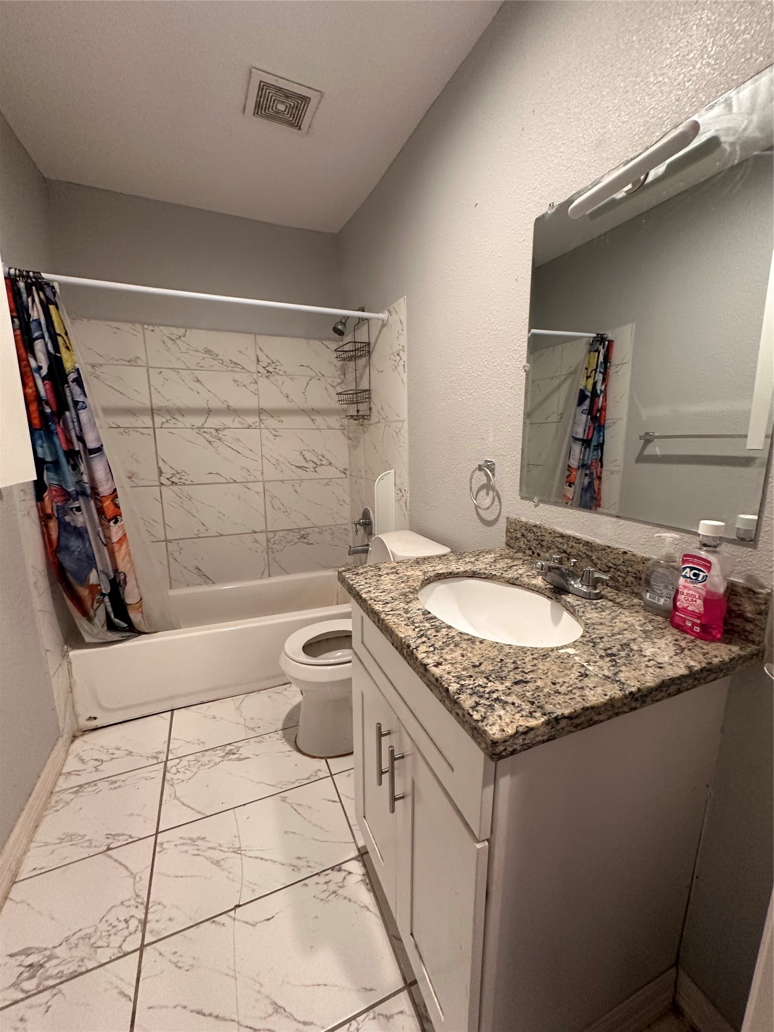 4802 Eppes Street Houston, TX 77021 - Photo 10 of 34 a bathroom with a granite countertop sink and a mirror