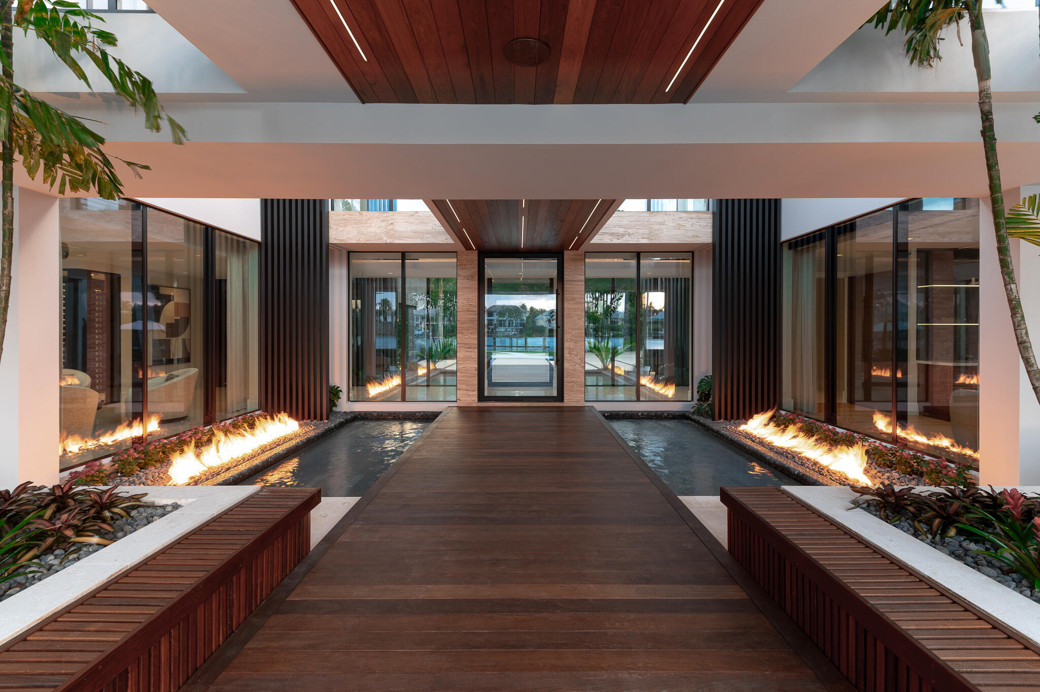 488 South Beach Road Jupiter Island, FL 33455 - Photo 41 of 54 a lobby with furniture and large windows