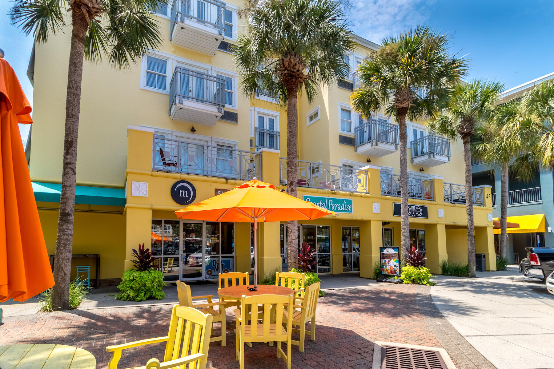 Lot 9 Ridge Road Santa Rosa Beach, FL 32459 - Photo 8 of 8 a view of a cafe with a table and chairs under an umbrella