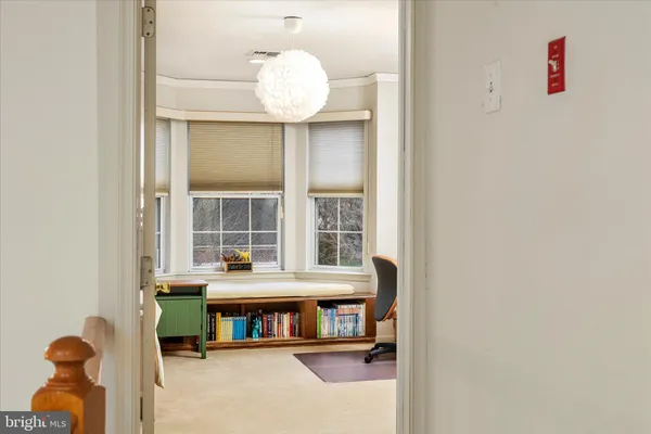 a bedroom with a workspace