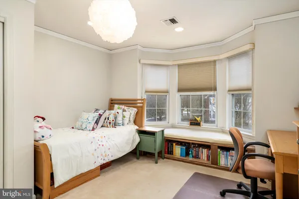 a view of a room with wooden floor and windows