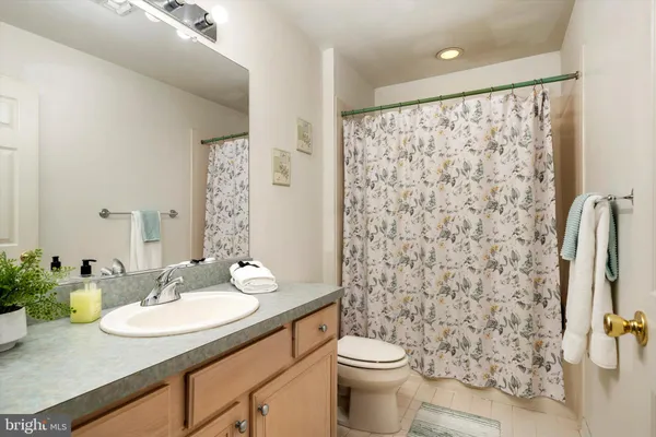 a bedroom with a bed and a chair