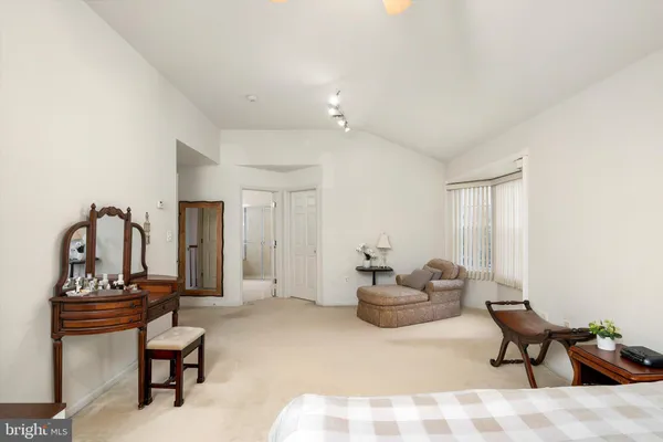 a view of walk in closet with clothes