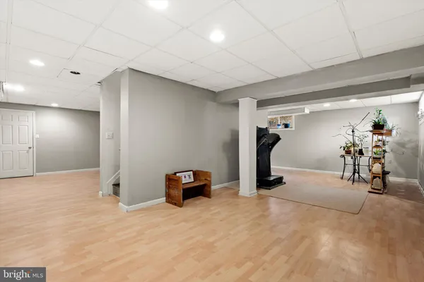 a view of a livingroom with workspace and a window