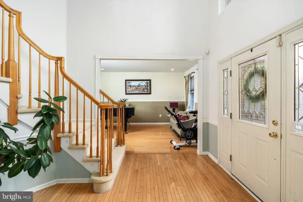 a view of entryway with wooden floor and furniture