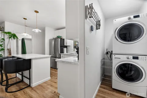a kitchen with a washer and dryer