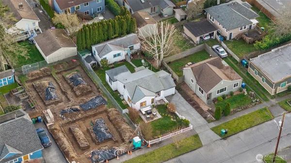an aerial view of residential houses with outdoor space