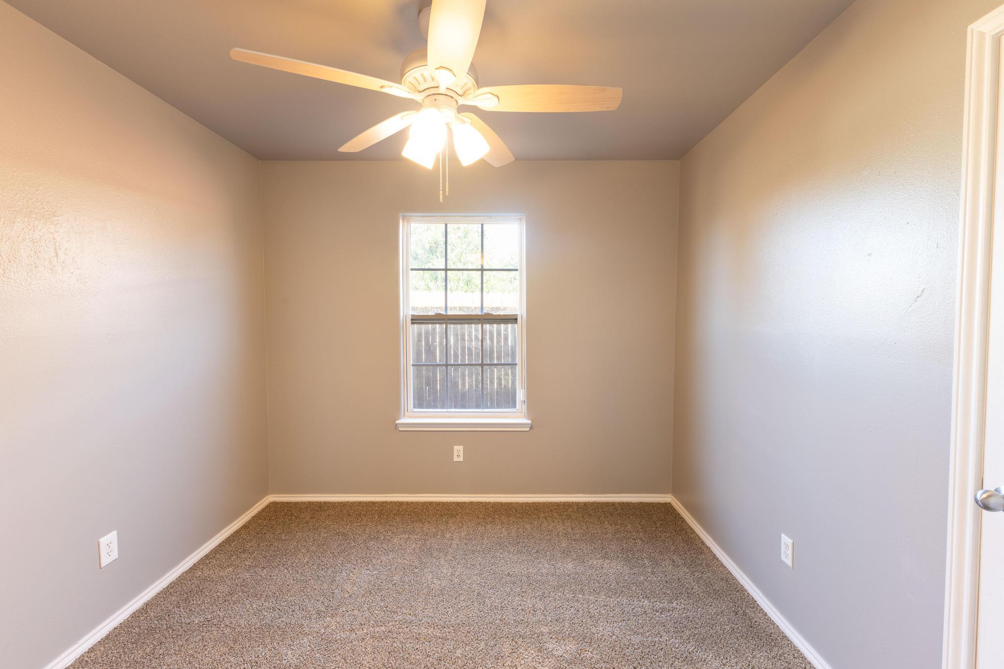 4425 Jarvis Street Lubbock, TX 79416 - Photo 8 of 16 an empty room with a window
