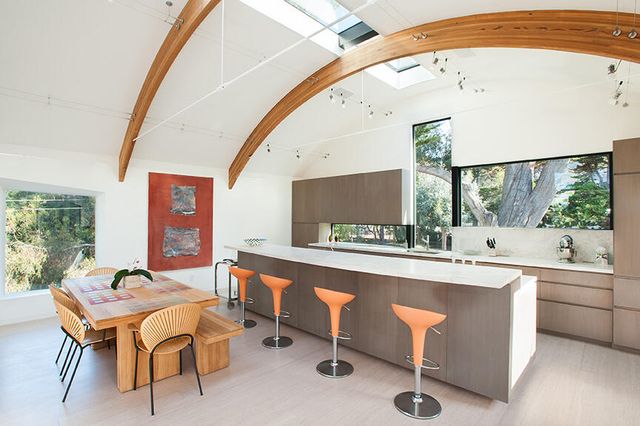 a dining room with a table and chairs