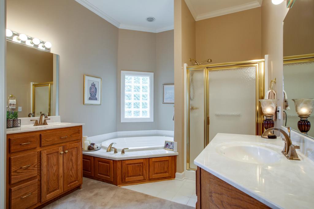 3340 Blazer Road Franklin, TN 37064 - Photo 15 of 29 a bathroom with a tub sink and mirror