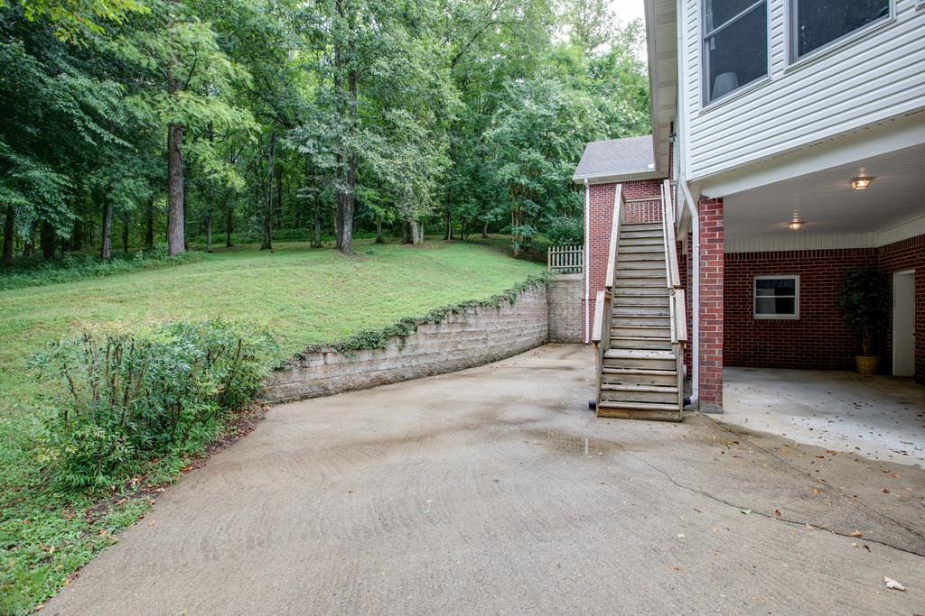 3340 Blazer Road Franklin, TN 37064 - Photo 24 of 29 a view of a house with backyard and trees