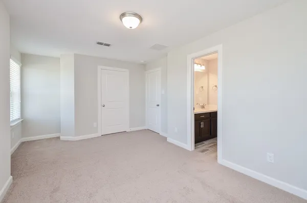 an empty room with closet area