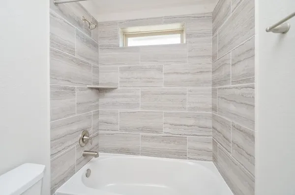 a bathroom with a sink a toilet and a bathtub