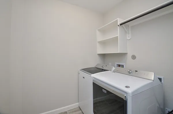 a view of a house with a garden and yard