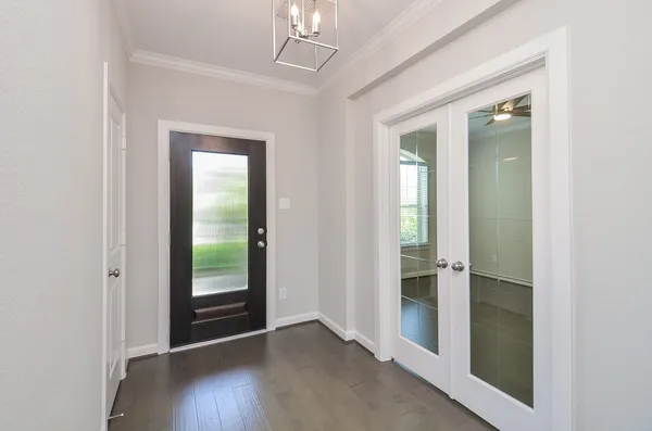 wooden floor in an empty room with a mirror