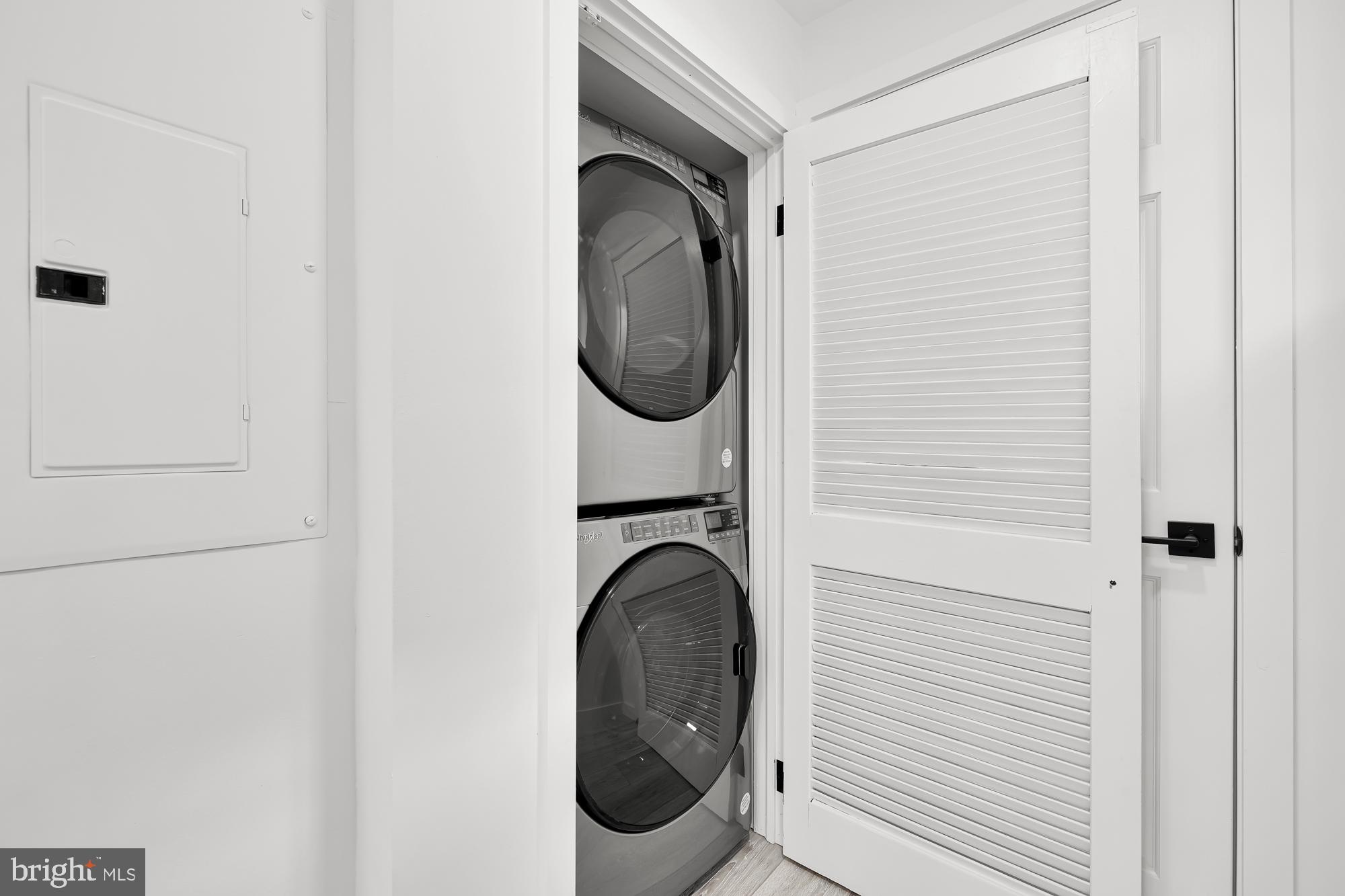 1821 19th Street Northwest, Unit 1 Washington, DC 20009 - Photo 15 of 24 a close view of a utility room with dryer and washer