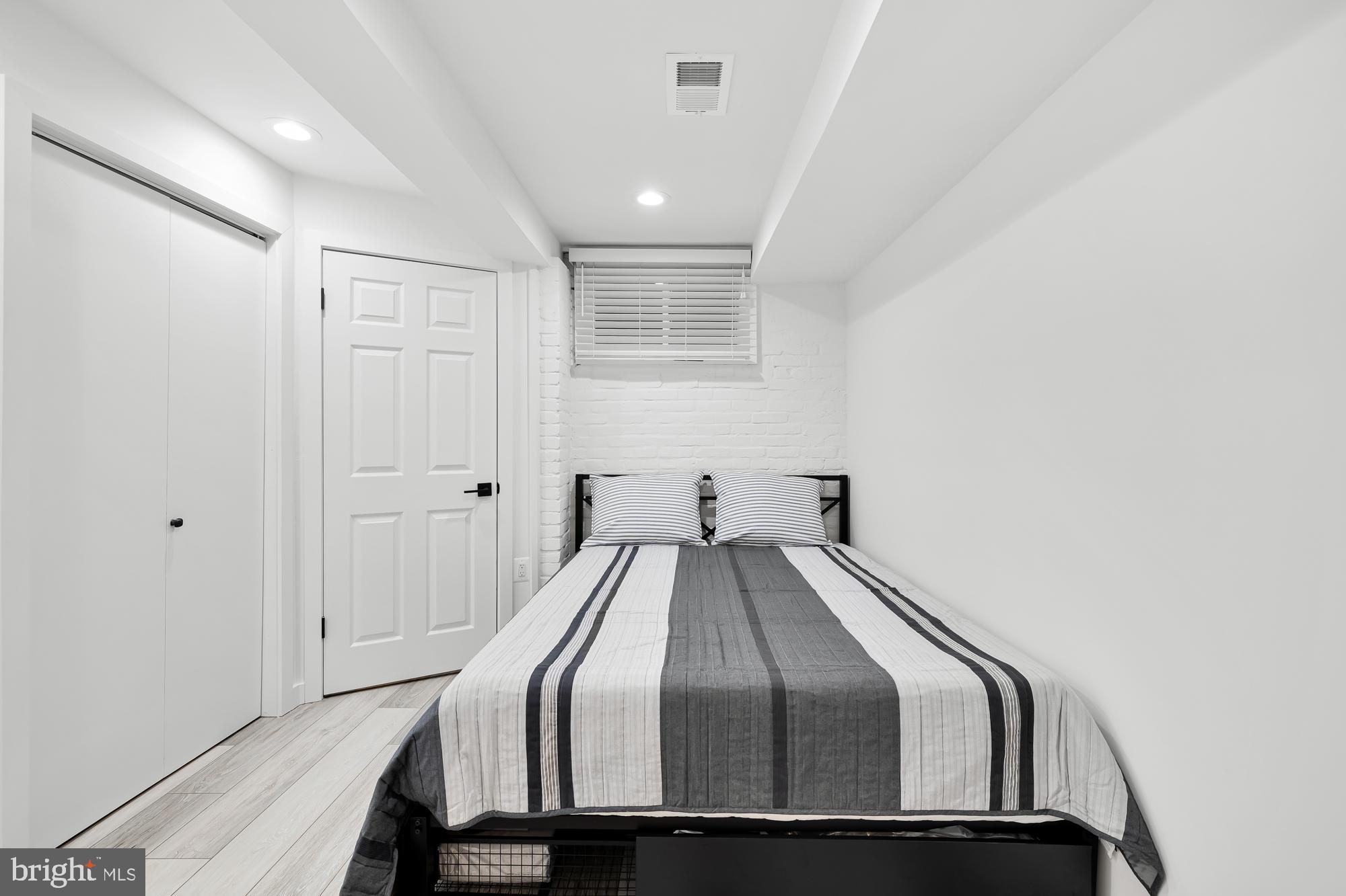 1821 19th Street Northwest, Unit 1 Washington, DC 20009 - Photo 18 of 24 a bedroom with a bed and a window