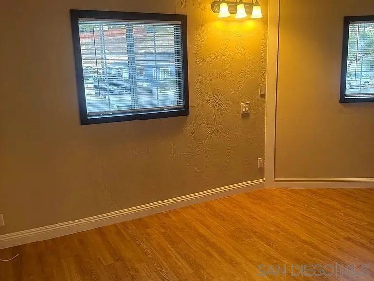 3206-16 Reynard Way San Diego, CA 92103 - Photo 9 of 12 an empty room with windows