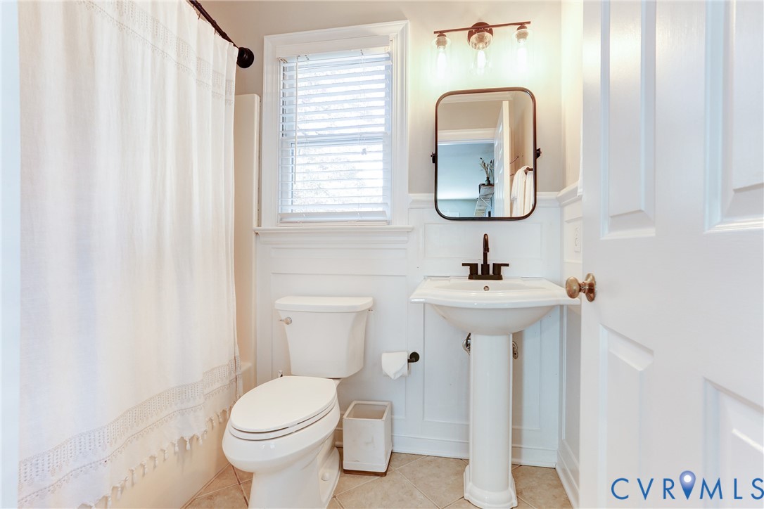 2003 Ridge Stone Court Henrico, VA 23238 - Photo 14 of 31 a bathroom with a toilet sink and mirror