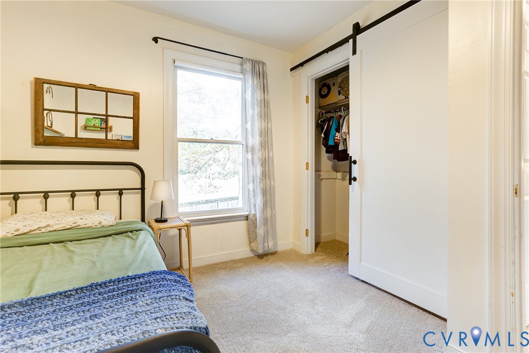 2003 Ridge Stone Court Henrico, VA 23238 - Photo 17 of 31 a room with a bed and a window