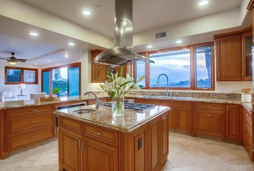 840 Highland Drive Solana Beach, CA 92075 - Photo 12 of 24 a kitchen with granite countertop a sink and cabinets