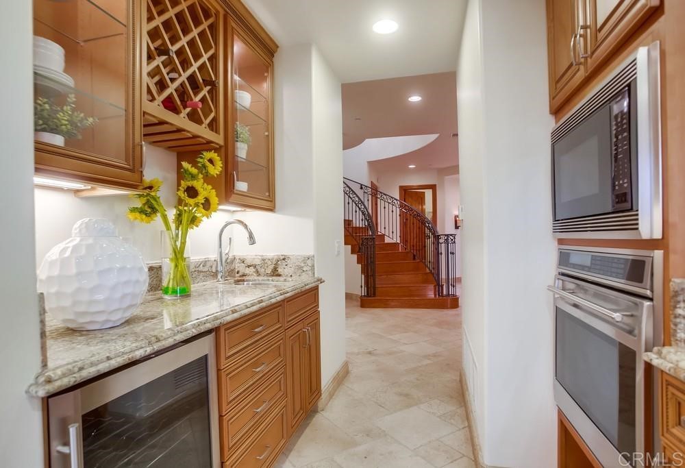 840 Highland Drive Solana Beach, CA 92075 - Photo 14 of 24 a kitchen with granite countertop stainless steel appliances and counter space