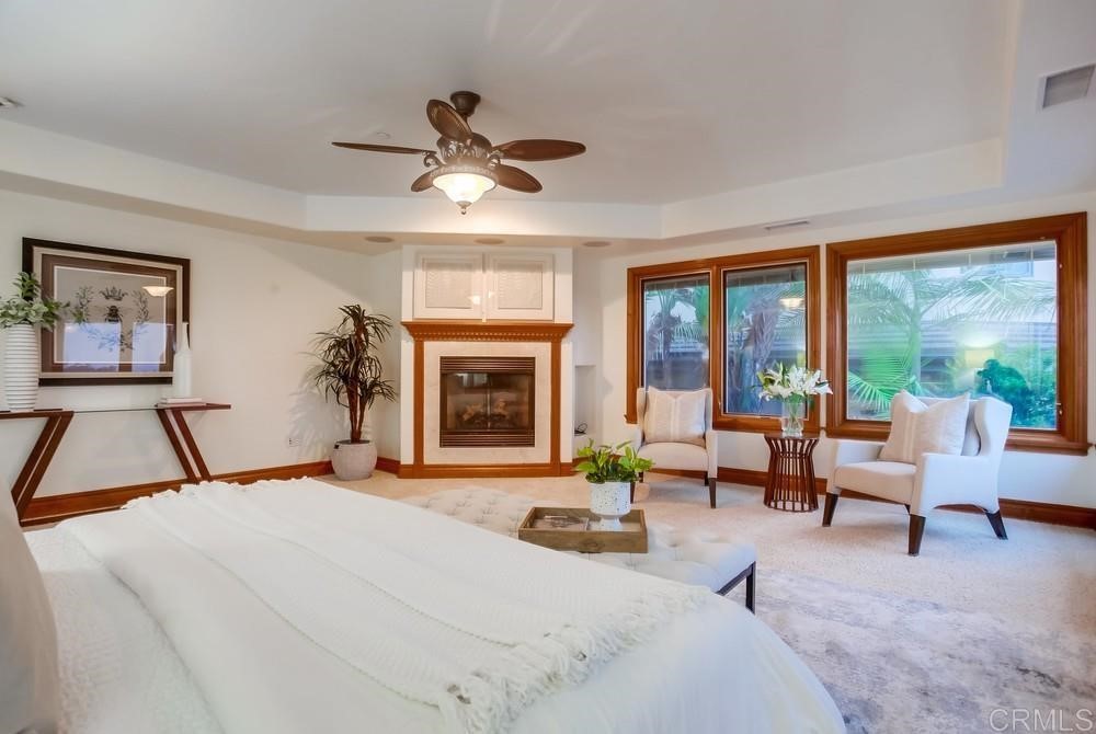 840 Highland Drive Solana Beach, CA 92075 - Photo 16 of 24 a bedroom with a bed and a large window