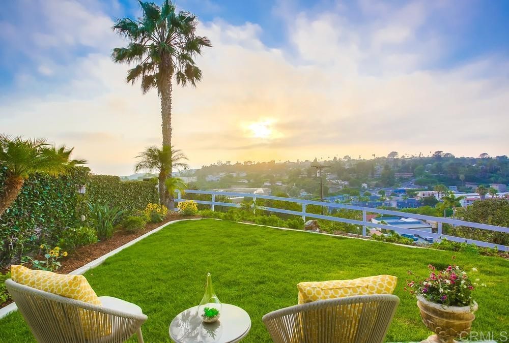 840 Highland Drive Solana Beach, CA 92075 - Photo 21 of 24 a view of a table and chairs in the garden