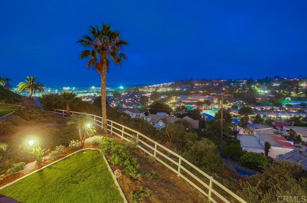 840 Highland Drive Solana Beach, CA 92075 - Photo 24 of 24 a view of a swimming pool with a table and chairs