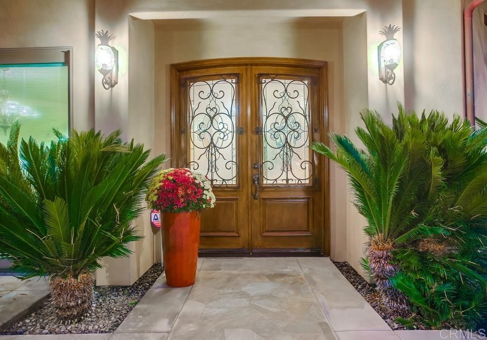 840 Highland Drive Solana Beach, CA 92075 - Photo 6 of 24 a potted plant in front of a yellow door