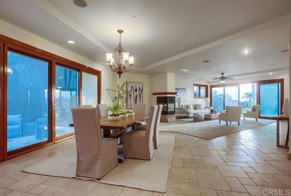 840 Highland Drive Solana Beach, CA 92075 - Photo 7 of 24 a view of a dining room with furniture and chandelier