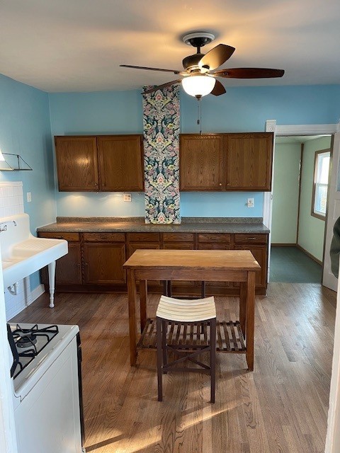 122 Elgin Avenue, Unit 2 Forest Park, IL 60130 - Photo 9 of 10 a kitchen with a table chairs and a stove