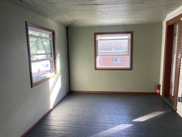 122 Elgin Avenue, Unit 2 Forest Park, IL 60130 - Photo 10 of 10 an empty room with wooden floor and windows