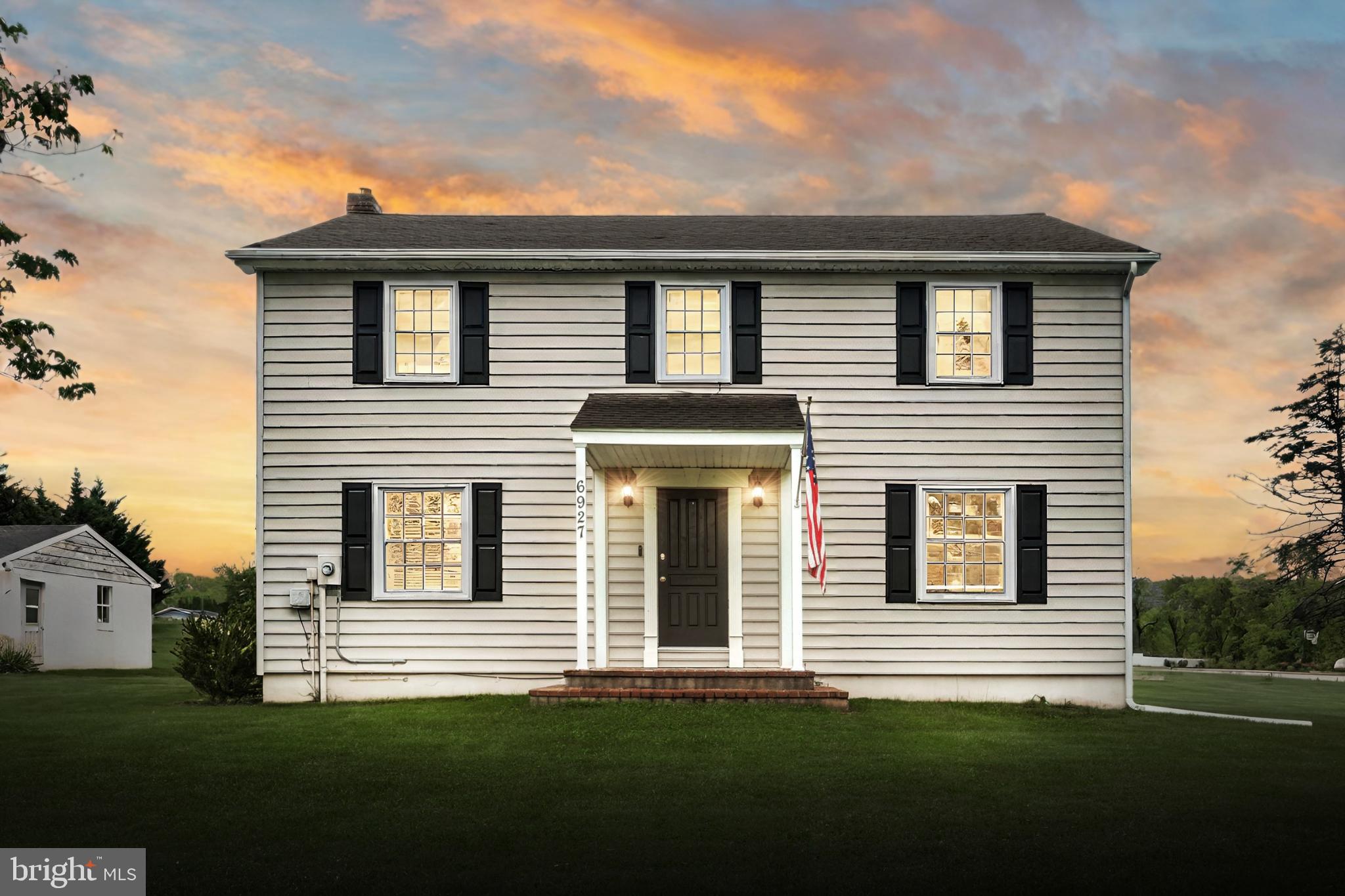 6927 York Road Abbottstown, PA 17301 - Photo 1 of 41 a front view of a house with a garden