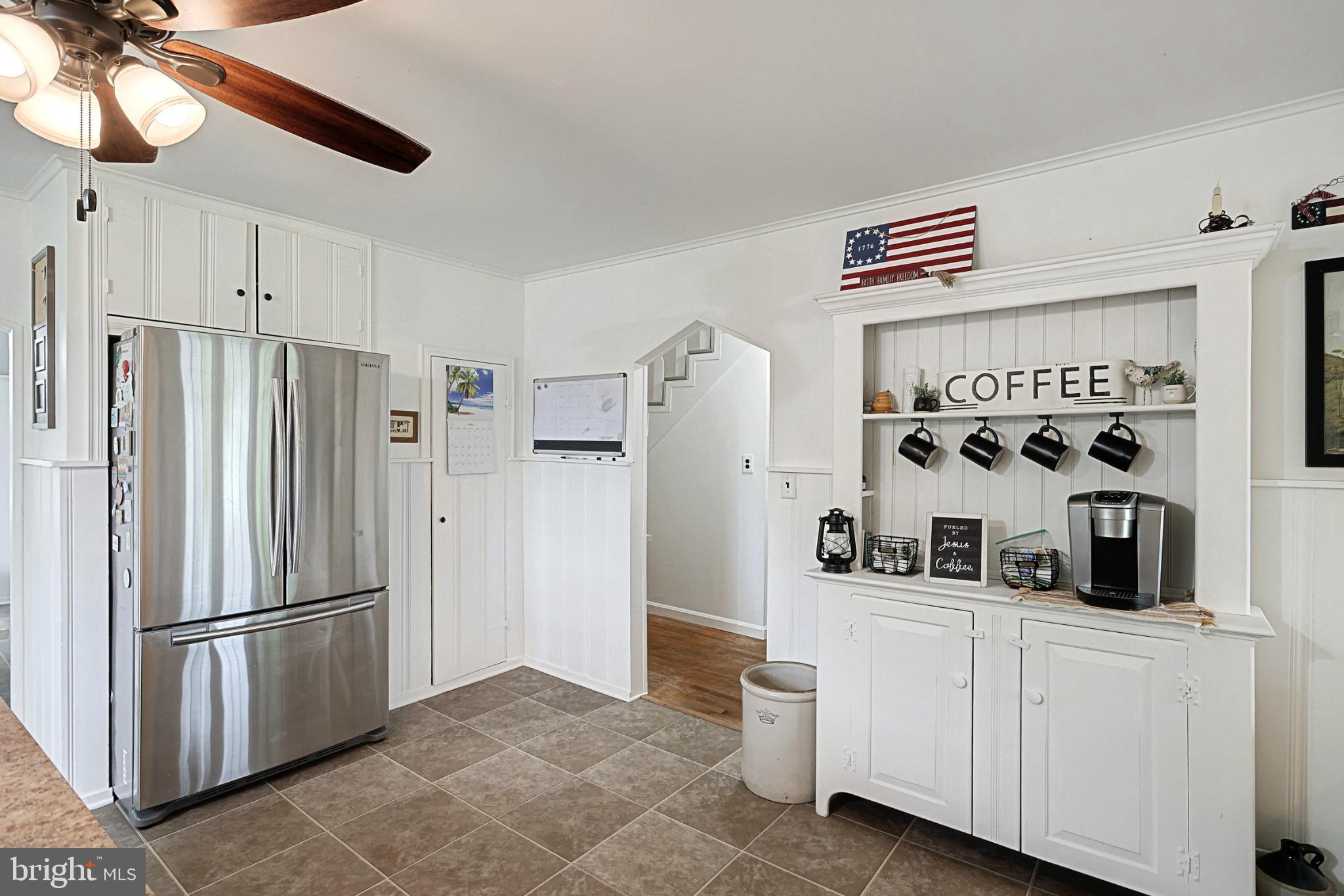 6927 York Road Abbottstown, PA 17301 - Photo 22 of 41 a kitchen with white cabinets and refrigerator